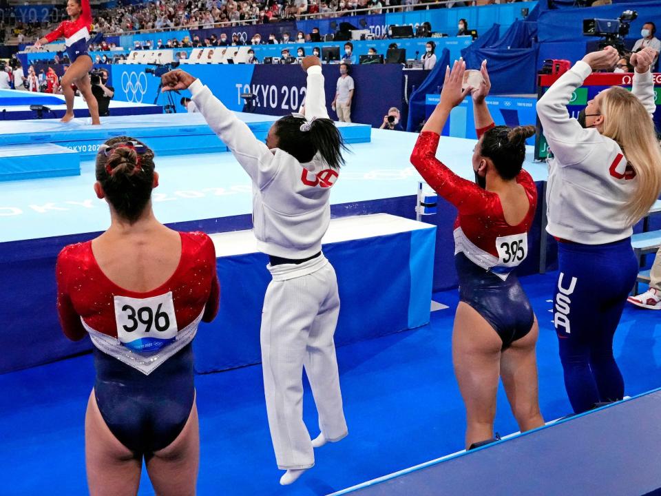 Simone Biles cheers on teammate Jordan Chiles.