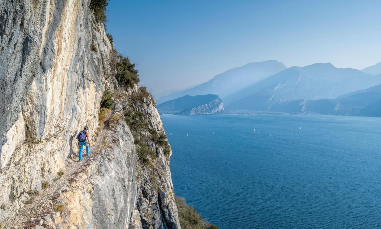 <span>A cliff route above Lake Garda, in northern Italy.</span><span>Photograph: mauritius images GmbH/Alamy</span>