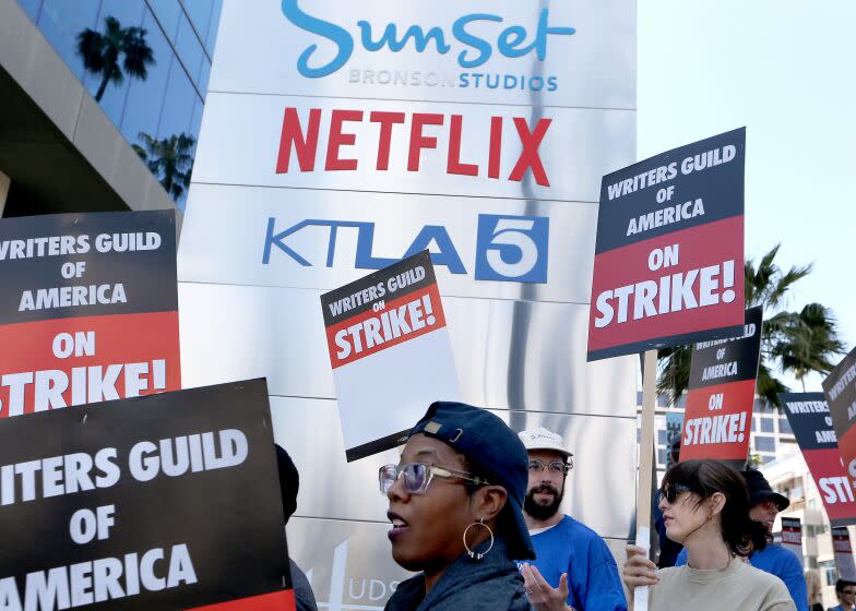 Los Angeles, CA - May 02: Striking Writers Guild of America workers picket outside the Sunset Bronson Studios on Tuesday, May 2, 2023. Los Angeles on Tuesday, May 2, 2023 in Los Angeles, CA. (Luis Sinco / Los Angeles Times)