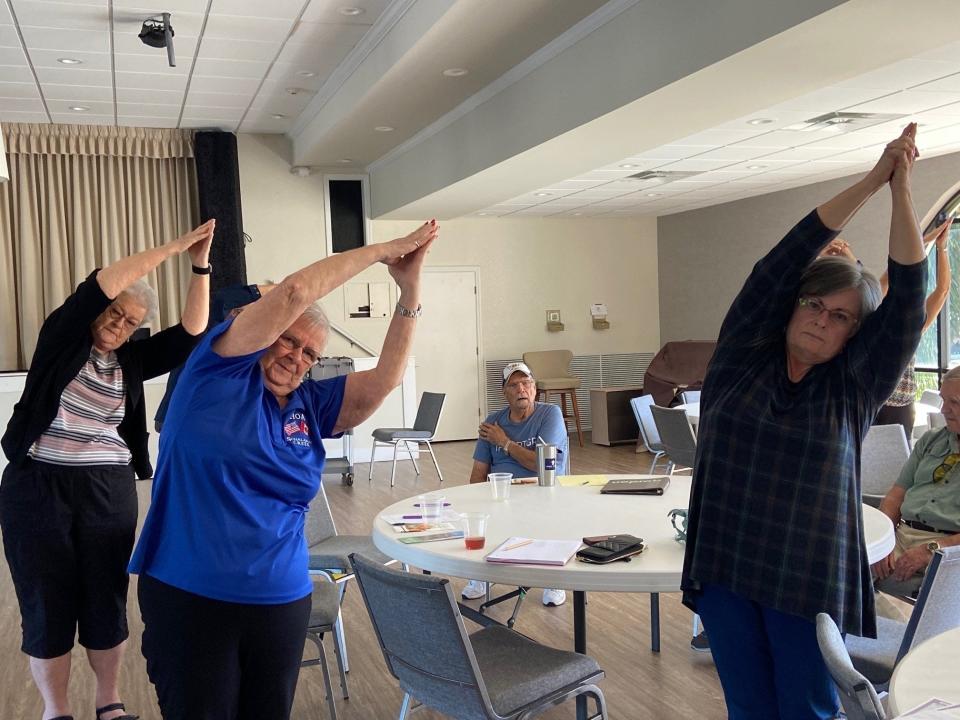 Norma Miller, MaryAnn Moerman and Terry Heald get active during an Alzheimer’s Association presentation on maintaining brain health held at Schalamar Creek in Lakeland. Physical activity is important for brain health.