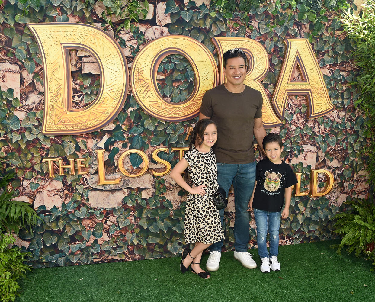 LOS ANGELES, CA - JULY 28:  Dominic Lopez, Mario Lopez, and Gia Francesca Lopez arrive at the LA Premiere Of Paramount Pictures' "Dora And The Lost City Of Gold" at Regal Cinemas L.A. Live on July 28, 2019 in Los Angeles, California.  (Photo by Gregg DeGuire/FilmMagic)