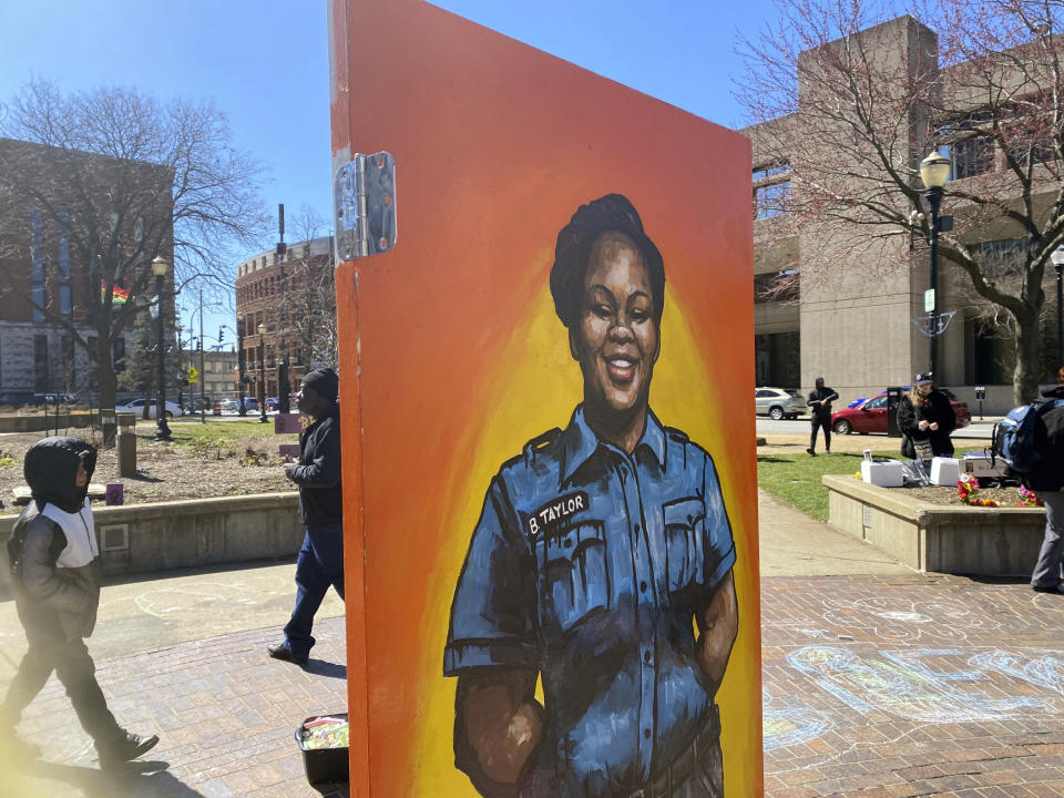 A painting of Breonna Taylor is among the art pieces decorating the center of Jefferson Square Park in Louisville, Ky., for a memorial on the two-year anniversary of Taylor's death, Sunday, March 13, 2022. (AP Photo/Piper Hudspeth Blackburn)