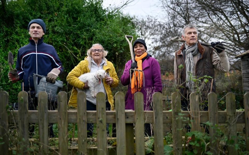 Anthony Agius, Gracie Gray, Marleny Rodriques and Anthony Brassil celebrate their win over along running planning dispute with the Duke of Northumberland