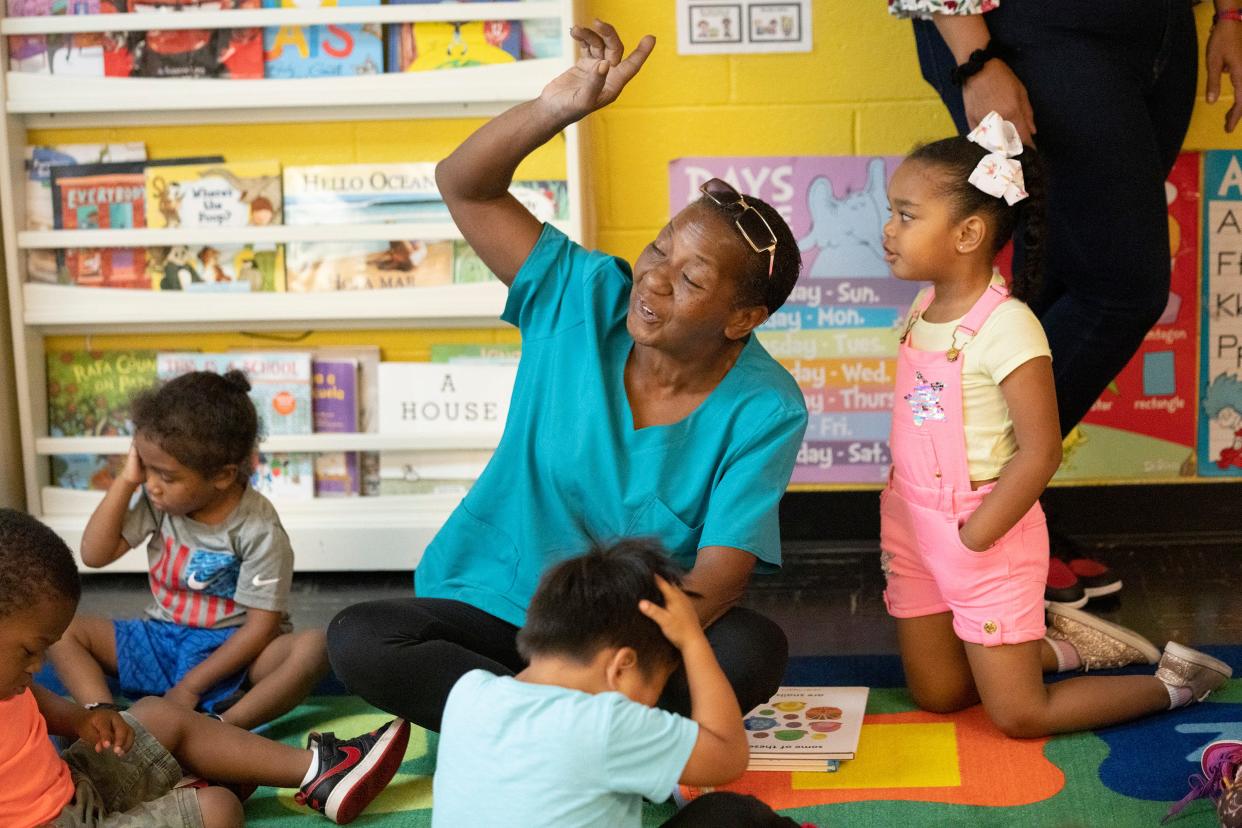 Aug 14, 2023; Columbus, OH, United States; Lead Teacher Cynthia Jones leads the children in a singalong at the My Little World Academy LLC Daycare. Jones teaches in the Pre-K classroom. 