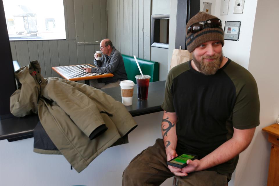 Patrons enjoy coffee at the new Rescue Cafe on Main Street in Fairhaven.