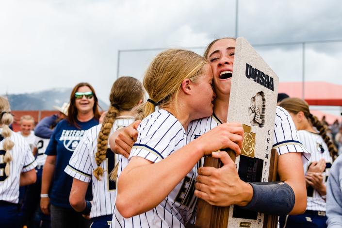 Enterprise’s Addison Nelson (10) hugs teammate Maicey Hunt (5) after winning the 2A girls softball finals at Spanish Fork Sports Park in Spanish Fork on May 13, 2023. | Ryan Sun, Deseret News