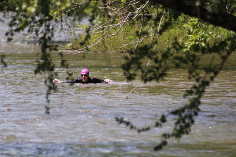 Laura Carney swimming the French Broad River.