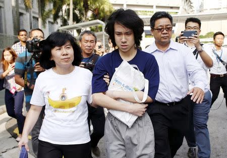 Teen blogger Amos Yee leaves with his parents after his sentencing from the State Court in Singapore July 6, 2015. REUTERS/Edgar Su/File Photo