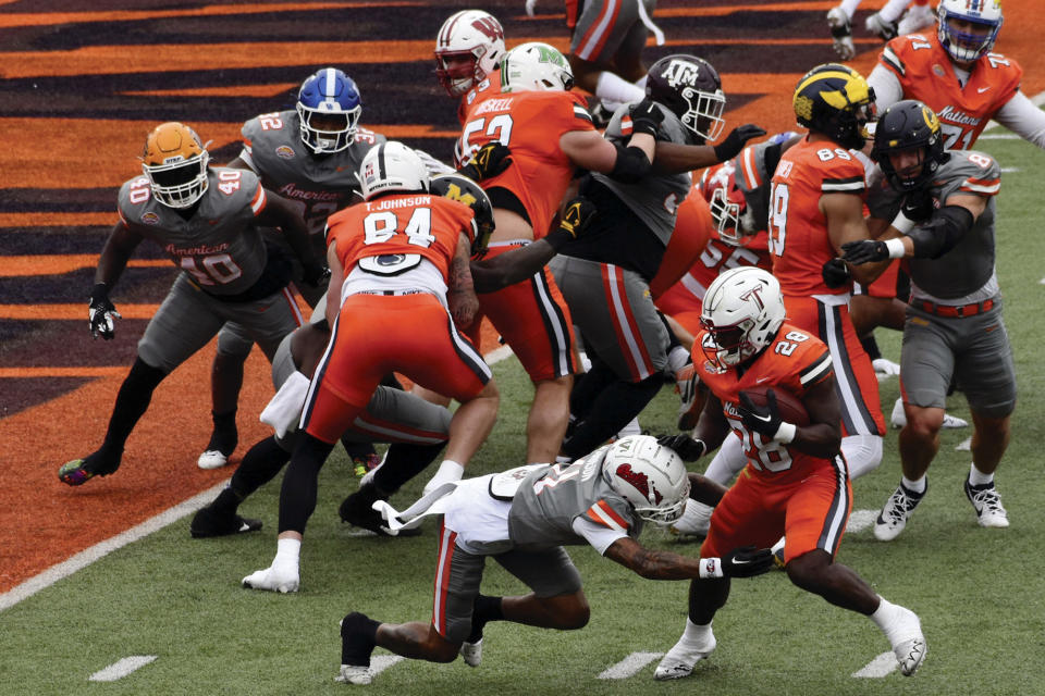 National Team running back Kimani Vidal (28), of Troy, tries to score during the Senior Bowl NCAA college football game, Saturday, Feb. 3, 2024 in Mobile, Ala. (Aimee Cronan/The Gazebo Gazette via AP)