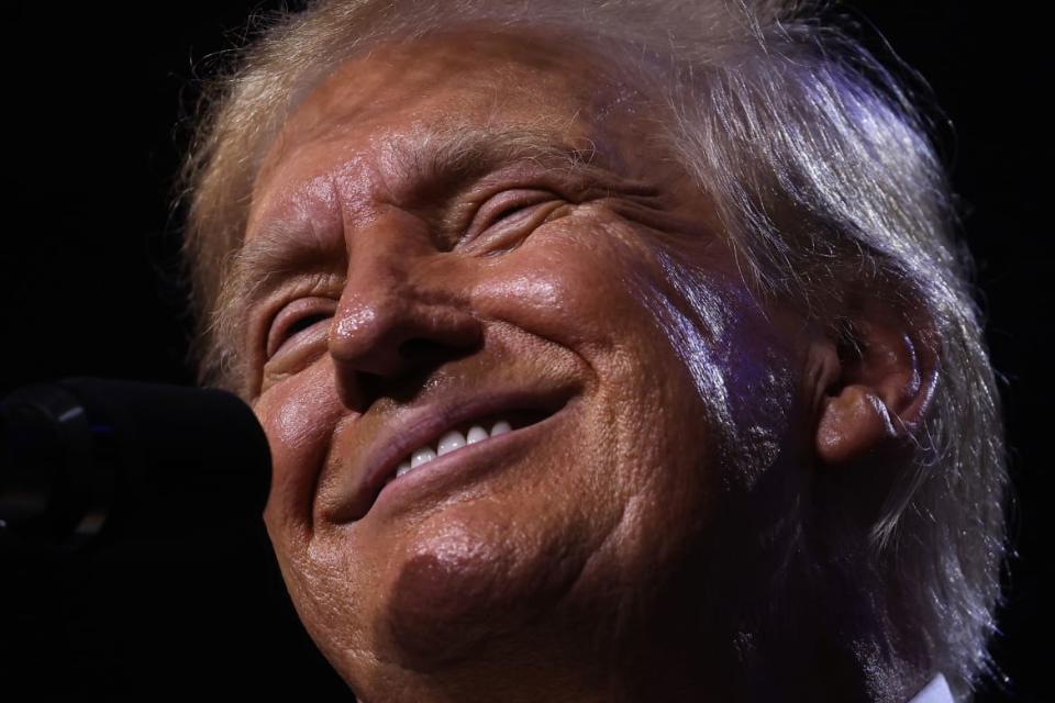 A close-up of a smiling Donald Trump. 