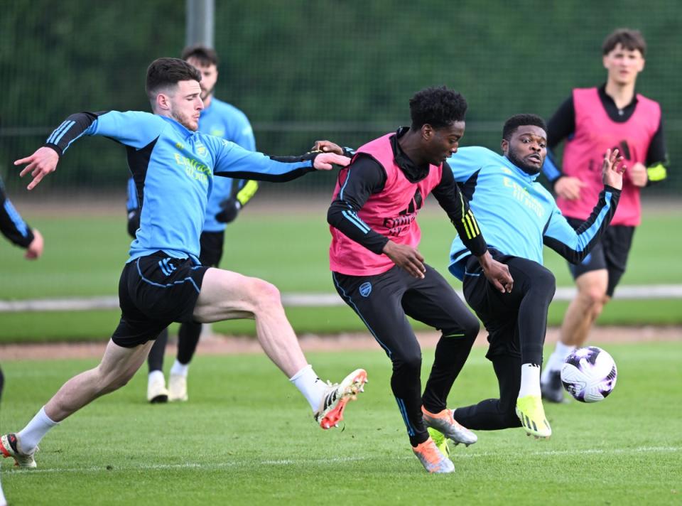 Full on: Partey, right, does not hold back in training (Arsenal FC via Getty Images)