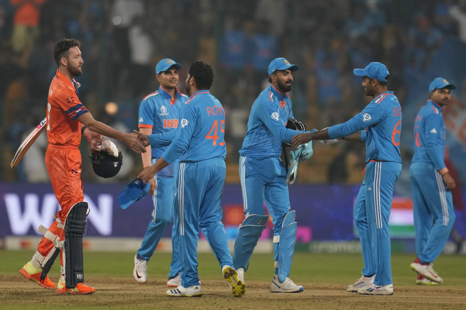 India's captain Rohit Sharma, third left, shakes hands with Netherlands' Paul Van Meekeren after winning the ICC Men's Cricket World Cup match against Netherlands in Bengaluru, India, Sunday, Nov. 12, 2023. (AP Photo/Aijaz Rahi)