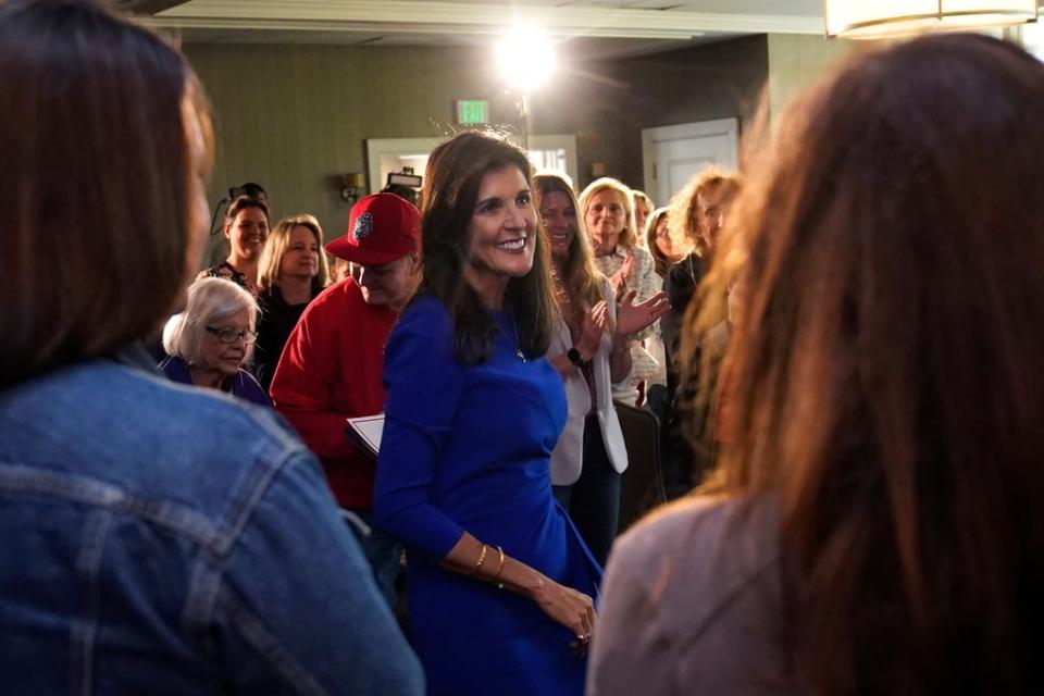 Republican presidential candidate Nikki Haley smiles while greeting guests during a campaign gathering, Wednesday, May 24, 2023, in Bedford, N.H.