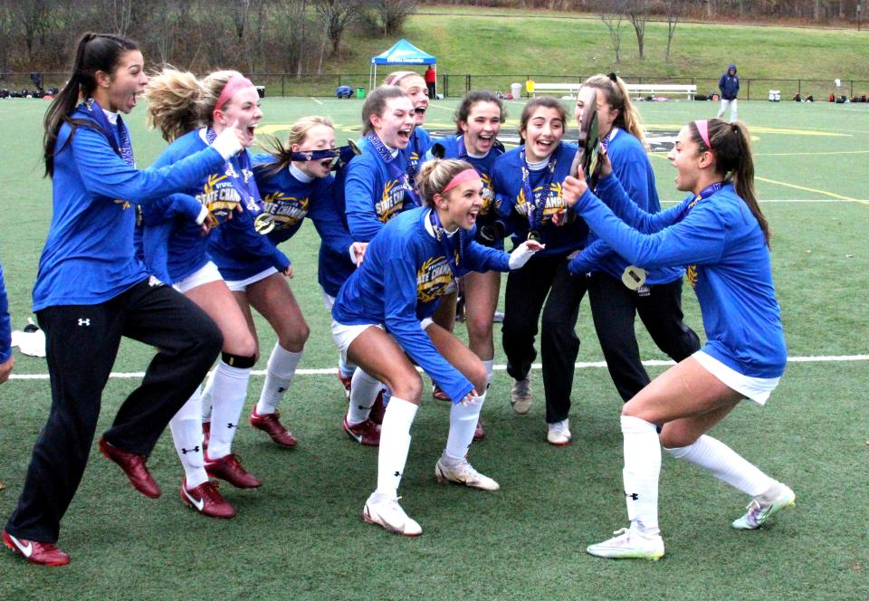 Albertus Magnus reacts after receiving the NYSPHSAA Class A championship plaque after defeating New Hartford, 3-1, in the state finals at Tompkins Cortland Community College on Sunday, Nov. 13, 2022.