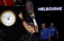 Switzerland's Roger Federer celebrates after defeating Australia's John Millman in their third round match at the Australian Open tennis championship in Melbourne, Australia, Saturday, Jan. 25, 2020.(AP Photo/Lee Jin-man)