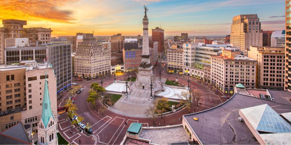 Indianapolis skyline over Soliders' and Sailors' Monument at dusk.