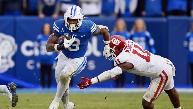 BYU running back Aidan Robbins brakes away for a long run ahead of Oklahoma Sooners linebacker Kobie McKinzie (11) at LaVell Edwards stadium in Provo on Saturday, Nov. 18, 2023. Robbins was "pumped" about his performance at Big 12 Pro Day in Frisco, Texas, Thursday, March 28, 2024.