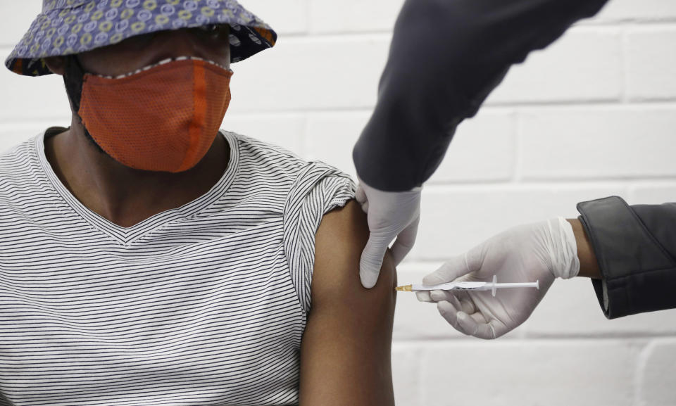 FILE - In this Wednesday, June 24, 2020 file photo, a volunteer receives a COVID-19 test vaccine injection developed at the University of Oxford in Britain, at the Chris Hani Baragwanath hospital in Soweto, Johannesburg, South Africa. Politicians and public health leaders have publicly committed to equitably sharing any coronavirus vaccine that works, but the top global initiative to make it happen may allow rich countries to reinforce their own stockpiles while making fewer doses available for poor ones. (AP Photo/Siphiwe Sibeko, FIle)