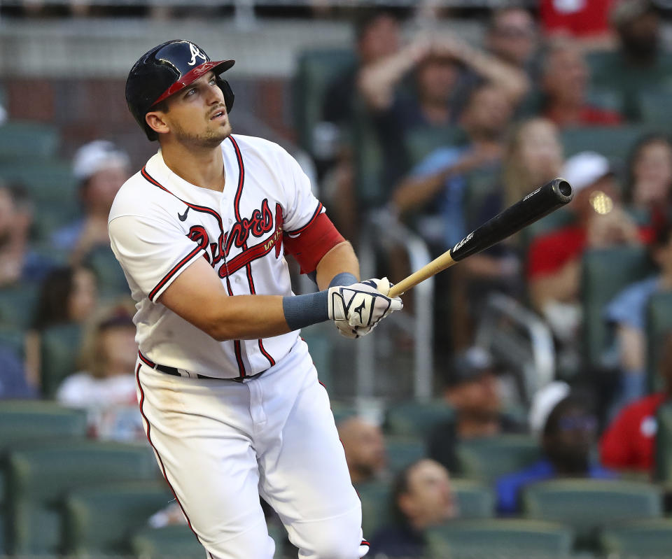 Atlanta Braves third baseman Austin Riley hits a two-RBI home run during the first inning of baseball game against the Colorado Rockies on Wednesday, Aug. 31, 2022, in Atlanta. (Curtis Compton/Atlanta Journal-Constitution via AP)