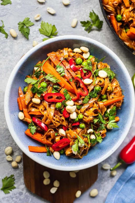 <p>Earth of Maria</p><p>Made with a flavourful sauce and topped with crunchy peanuts, this easy vegan Pad Thai together in under 15 minutes. Gluten-free and oil-free.</p><p><strong>Get the recipe: <a href="https://earthofmaria.com/easy-vegan-pad-thai/" rel="nofollow noopener" target="_blank" data-ylk="slk:Easy Vegan Pad Thai;elm:context_link;itc:0;sec:content-canvas" class="link rapid-noclick-resp"><em>Easy Vegan Pad Thai</em></a></strong></p>