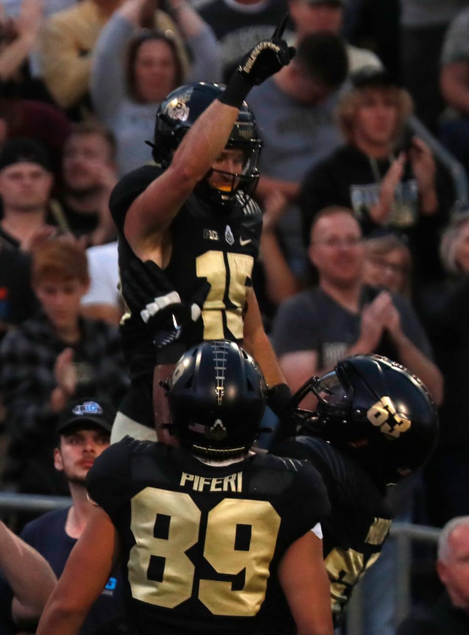 Purdue Boilermakers wide receiver Charlie Jones (15) celebrates with teammates after scoring a touchdown during the NCAA football game against the Florida Atlantic Owls, Saturday, Sept. 24, 2022, at Ross-Ade Stadium in West Lafayette, Ind. 