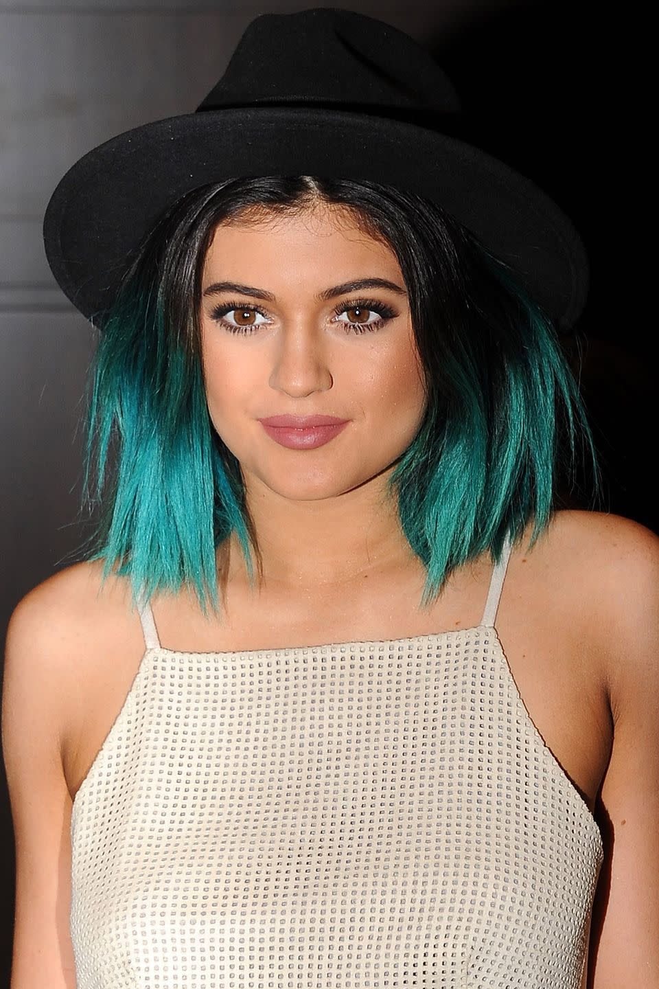 <p>A teal lob and rose lipstick in 2014. </p>