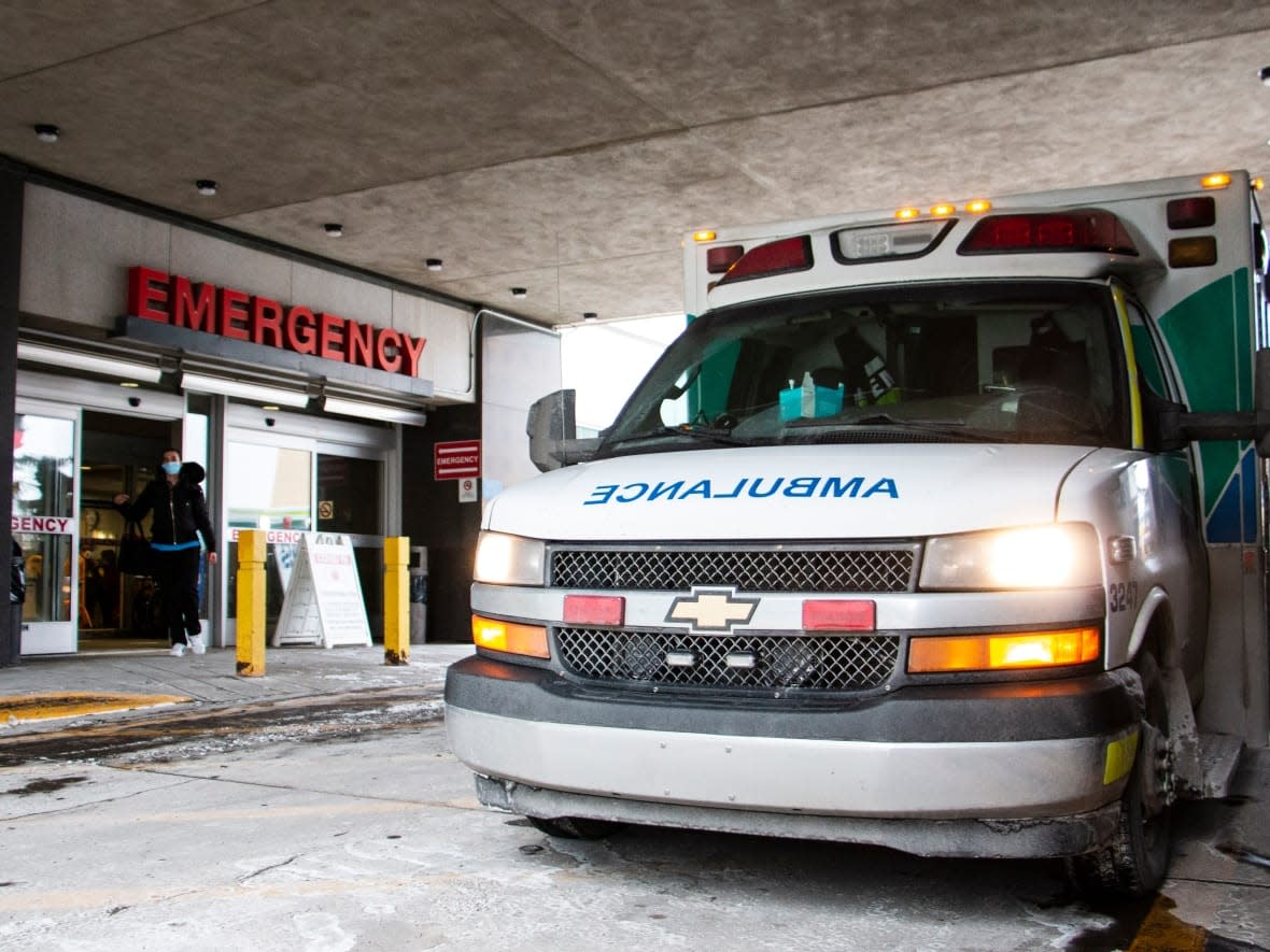 An ambulance delivers a patient to Foothills Medical Centre in Calgary on Tuesday. (Oseremen Irete/CBC - image credit)