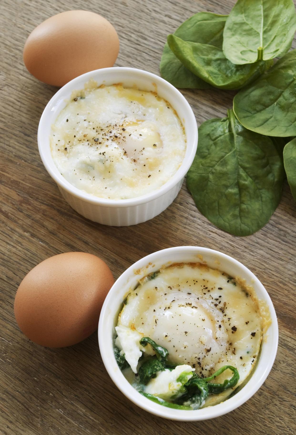 A french egg dish cooked in a ramekin. This is the version made with spinach eggs and parmesan cheese.