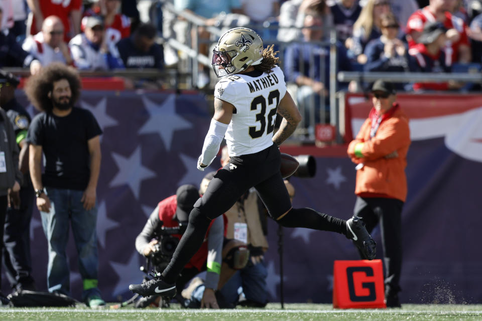 New Orleans Saints safety Tyrann Mathieu runs into the end zone for a touchdown after intercepting a pass by New England Patriots quarterback Mac Jones during the first half of an NFL football game, Sunday, Oct. 8, 2023, in Foxborough, Mass. (AP Photo/Michael Dwyer)