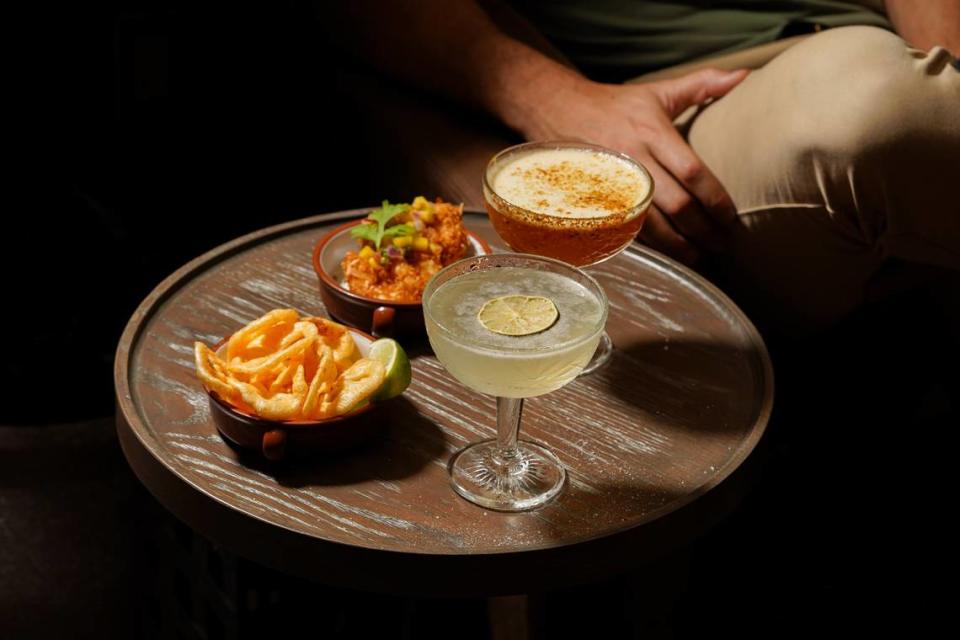 A house margarita and the Elote cocktail ( Mezcal Vago Elote infused with charred pineapple, lemon, egg white, hot honey, and a pineapple smoked hatch chile salt rim) at the new Bodega in Coral Gables.