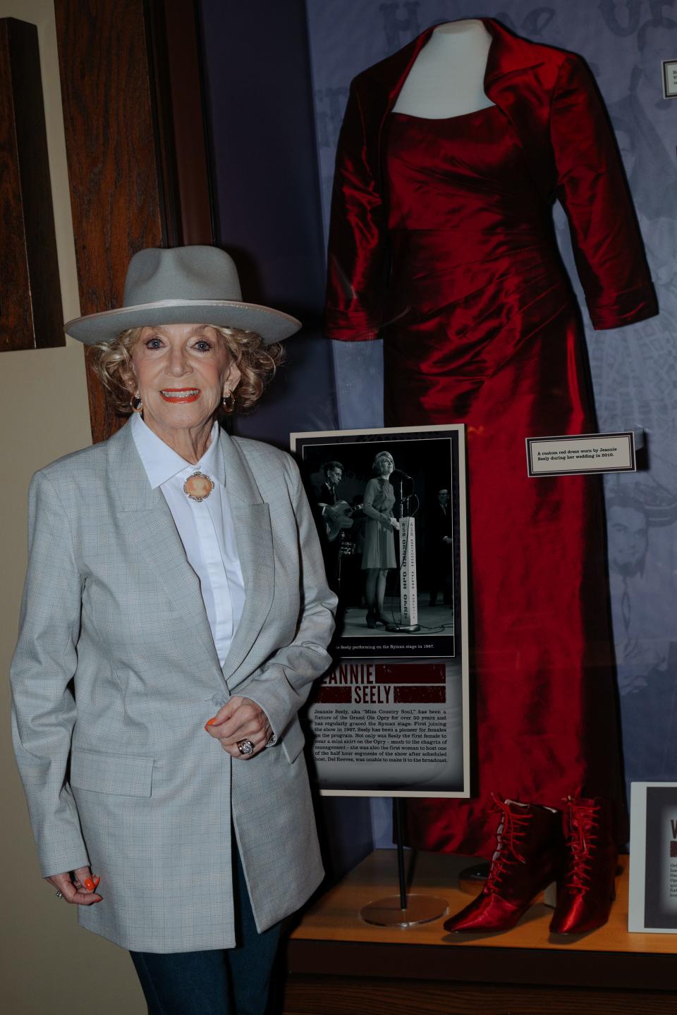 Grammy-winner Jeannie Seely stands next to her addition to a Ryman Auditorium exhibition honoring the Grand Ole Opry's "golden era."