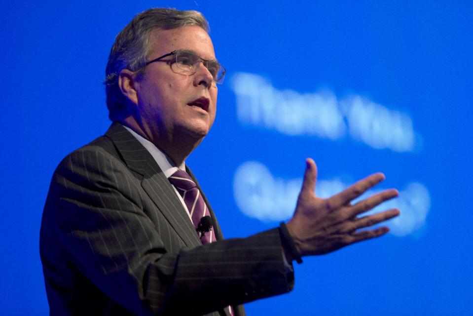 FILE - This Jan. 29, 2014 file photo shows former Florida Gov. Jeb Bush speaking in Hollywood, Fla. Will Jeb Bush run for president? The former Florida governor says he’s undecided but his decision is one of the most significant unknowns looming over the 2016 Republican presidential contest. A White House bid by the scion of the Bush political dynasty would shake up a wide-open field and set up a showdown with the tea party movement. (AP Photo/Wilfredo Lee, File)