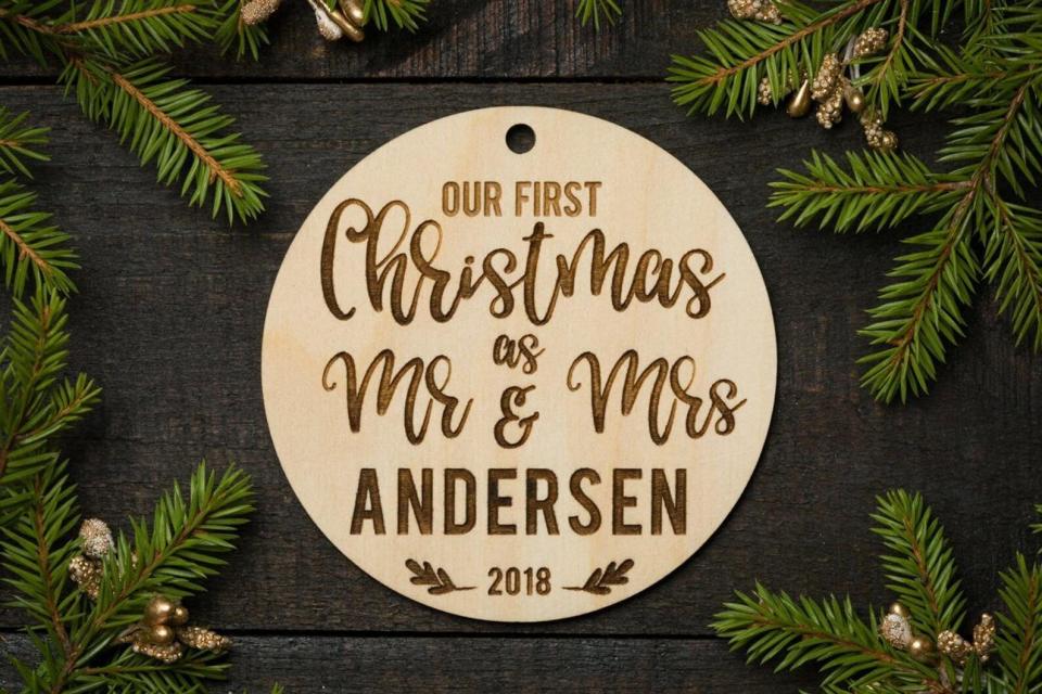 Commemorate their special day with a keepsake ornament.&nbsp;<strong><a href="https://www.etsy.com/listing/634490342/christmas-ornament-mr-and-mrs-christmas?ga_order=highest_reviews&amp;ga_search_type=all&amp;ga_view_type=gallery&amp;ga_search_query=christmas+ornaments+couple&amp;ref=sr_gallery-3-29&amp;organic_search_click=1&amp;frs=1&amp;col=1" target="_blank" rel="noopener noreferrer">Get this customized Christmas ornament for $14.99</a>.</strong>