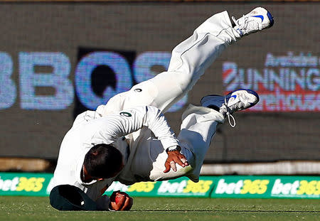 Cricket - Australia v South Africa - First Test cricket match - WACA Ground, Perth, Australia - 5/11/16 Australia's Usman Khawaja dives to take a catch to dismiss South Africa's Temba Bavuma at the WACA Ground in Perth. REUTERS/David Gray