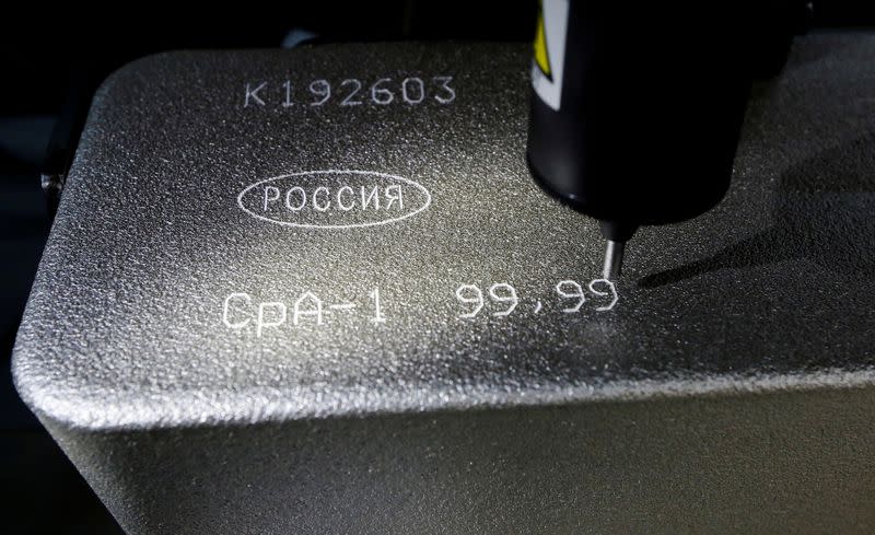 FILE PHOTO: Machine engraves information on 99.99 percent pure silver ingot at Krastsvetmet non-ferrous metals plant in Krasnoyarsk