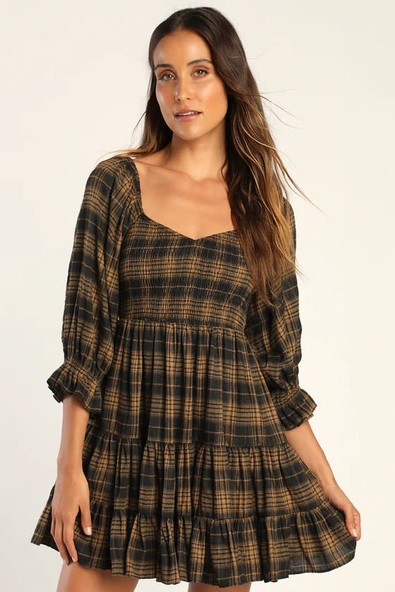 model wearing brown and black flannel dress