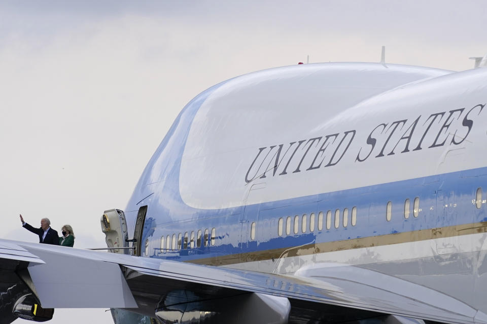 President Joe Biden waves as he and first lady Jill Biden board Air Force One at Ellington Field Joint Reserve Base in Houston, Friday, Feb. 26, 2021. The Bidens are en route to Washington. (AP Photo/Patrick Semansky)