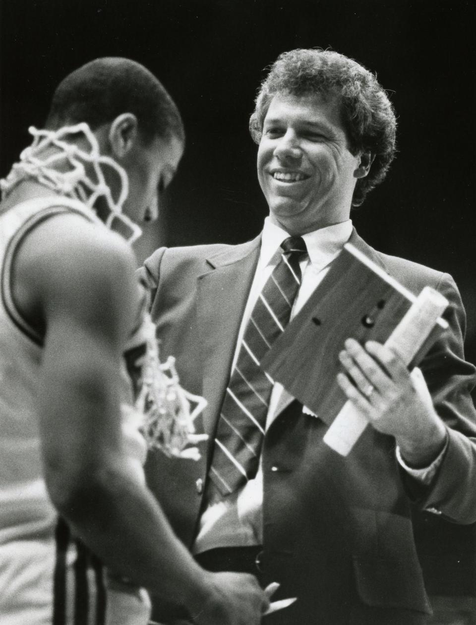Former Central-Hower boys basketball coach Mike Meneer celebrates the team's Class AAA state championship in 1986.
