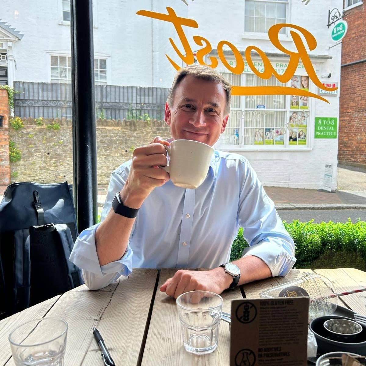 Jeremy Hunt stops for a coffee in local cafe as he campaigns in Godalming