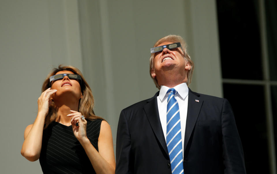 U.S. President Donald Trump and Melania Trump watch the solar eclipse from the White House. (Photo: Kevin Lamarque/Reuters)