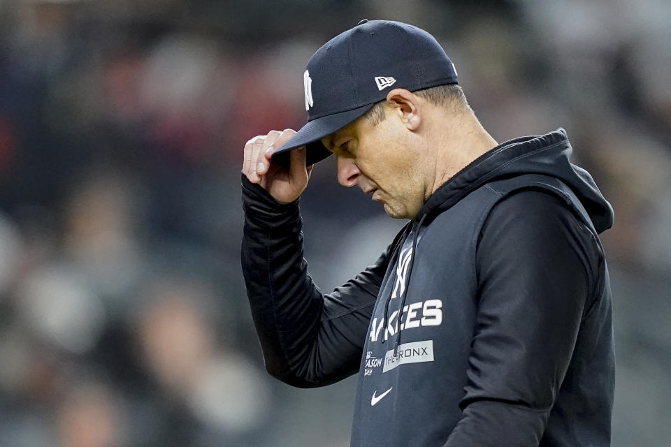 New York Yankees manager Aaron Boone walks off the field after a pitching change during the sixth inning of Game 3 of an American League Championship baseball series against the Houston Astros, Saturday, Oct. 22, 2022, in New York. (AP Photo/John Minchillo)