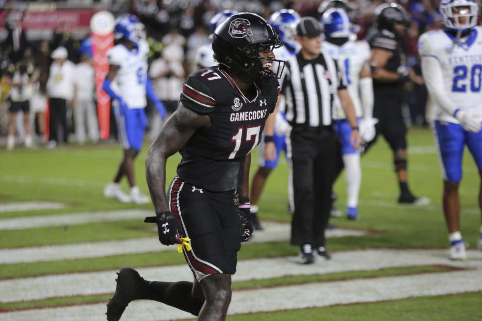 South Carolina wide receiver Xavier Legette (17) sticks his tongue out to celebrate scoring the go-ahead touchdown against Kentucky during the second half of an NCAA college football game Saturday, Nov. 18, 2023, in Columbia, S.C. (AP Photo/Artie Walker Jr.)