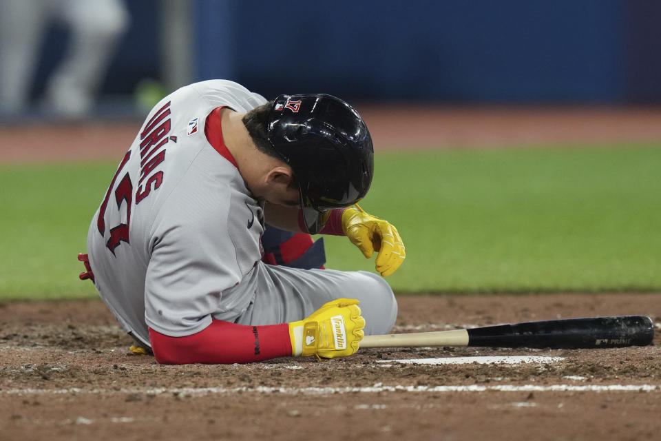 Boston Red Sox's Luis Urias falls to the ground after a pitch by Toronto Blue Jays relief pitcher Jordan Hicks during the eighth inning of a baseball game in Toronto, Friday, Sept. 15, 2023. (Chris Young/The Canadian Press via AP)