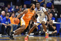 Tennessee guard Josiah-Jordan James (30) drives around Kentucky guard Adou Thiero (3) during the second half of an NCAA college basketball game in Lexington, Ky., Saturday, Feb. 3, 2024. Tennessee won 103-92. (AP Photo/Timothy D. Easley)