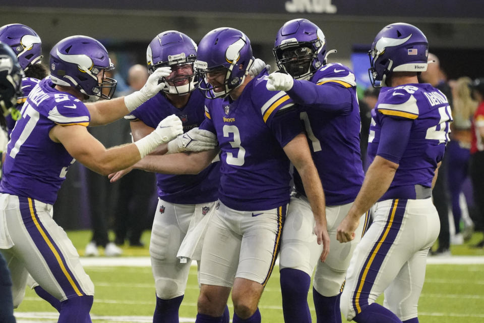 Minnesota Vikings punter Jordan Berry (3) is congratulated by teammates after a punt to the 1-yard-line to the Seattle Seahawks in the second half of an NFL football game in Minneapolis, Sunday, Sept. 26, 2021. (AP Photo/Jim Mone)