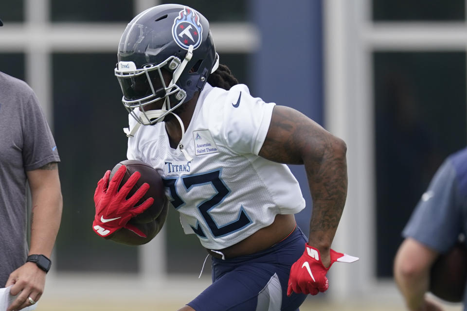 Tennessee Titans running back Derrick Henry (22) runs up the field during practice at the NFL football team's training facility Wednesday, June 7, 2023, in Nashville, Tenn. (AP Photo/George Walker IV)