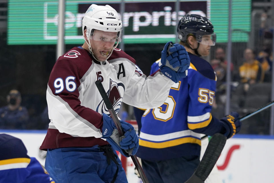 Colorado Avalanche's Mikko Rantanen (96) celebrates after scoring as St. Louis Blues' Colton Parayko (55) skates in the background during the third period in Game 4 of an NHL hockey Stanley Cup first-round playoff series Sunday, May 23, 2021, in St. Louis. (AP Photo/Jeff Roberson)