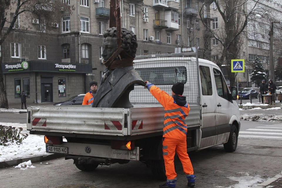 In this photo released by the Dnipro Region Administration, Municipal workers dismantle a monument of Russian writer Alexander Pushkin in the city centre of Dnipro, Ukraine, Friday, Dec. 16, 2022. Ukraine is accelerating efforts to erase the vestiges of centuries of Soviet and Russian influence from the public space by pulling down monuments and renaming hundreds of streets to honor home-grown artists, poets, military chiefs, and independence leaders, even heroes of this year's war. (Dnipro Region Administration via AP)