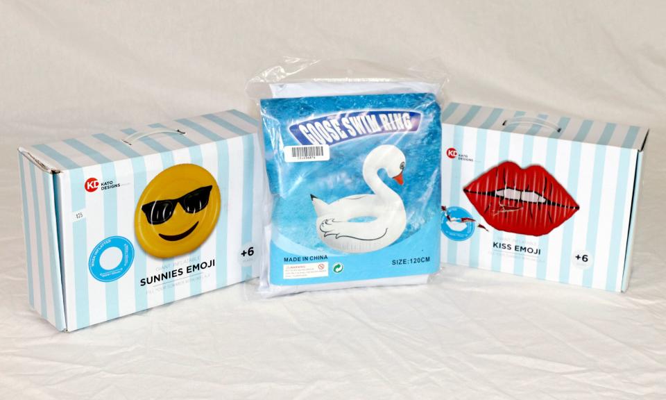 Pictured are packaged toys including an inflatable sunnies emoji, a goose swim ring and an inflatable kiss emoji.