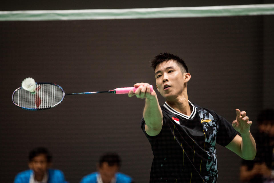 Singapore shuttler Loh Kean Yew in action in the men's team quarter-final against the Philippines at the 2023 SEA Games. (PHOTO: SNOC/Lim Weixiang)